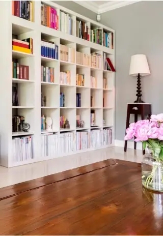 living room with organized bookcase