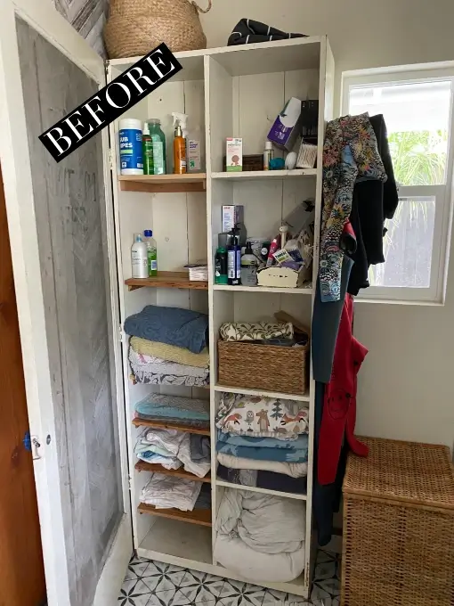 Bathroom storage cabinet before organization